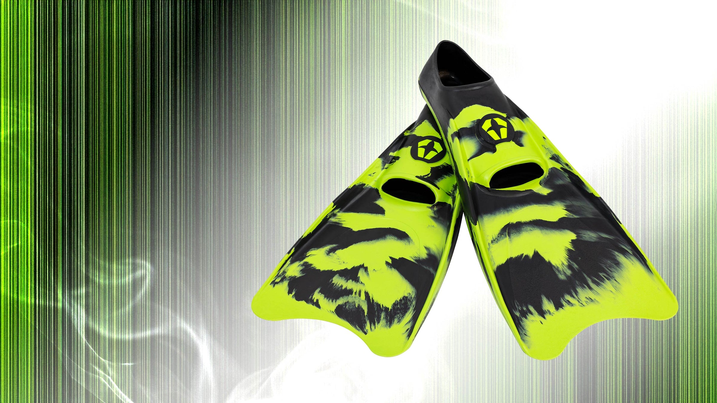 Pair of green and black diving fins on a green and gray gradient background
